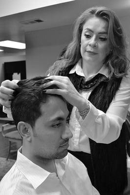 Finishing details on his haircut