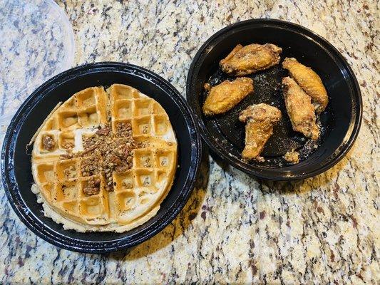 Waffle with pecans and garlic parm wings.