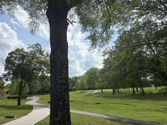 No playground and you have to park at one of the nearby businesses, but it's a pleasant green spot to walk or sit.
