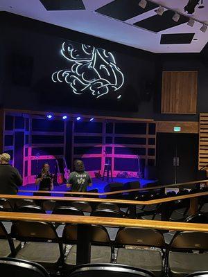 Stage Holds about 100.