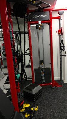 LifeFitness Synergy90. Nearly limitless variety of exercise options in one space. A rope pulley and TRX straps too!