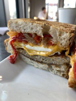 Sausage, Egg, & Cheese $5.50 House-made Bread, Add Cheddar +$0.50, Add Roasted Red Peppers +$0.50, Add Caramelized Onions +$0.75