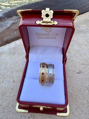 2 rings (gold with ruby and white gold with aquamarine).