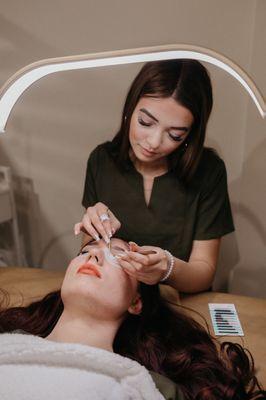 Emily doing what she does best- creating beautiful lash extension sets!