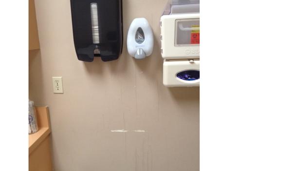 Another shot of the exam room. Looks like the hand sanitizer had been dripping down the wall for a while.