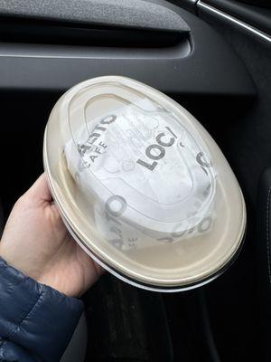 To go container with breakfast sandwich