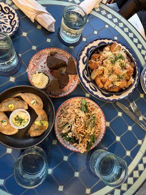 Empanadas, Pencil shavings with broccolini, dry cornbread and patas bravas.