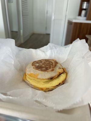 Two eggs, cheddar on English muffin.