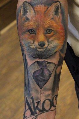 Akoo gentleman fox done in color on the forearm.