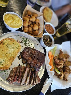 The meal - ribs/tri tip, mac and cheese, fried mushrooms, baked beans, collard greens, lemon pepper wings