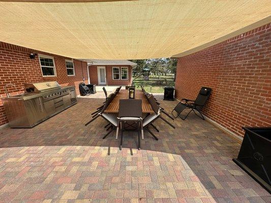 $15,000 paver patio. Complete with outdoor furniture and grill station.
