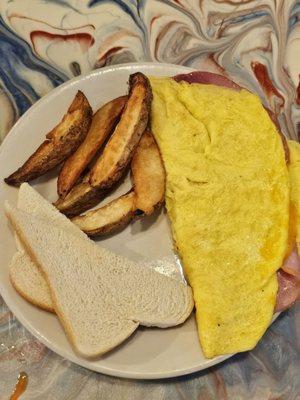 Ham and cheese omelette uses sliced ham. The fries are homemade and delicious!