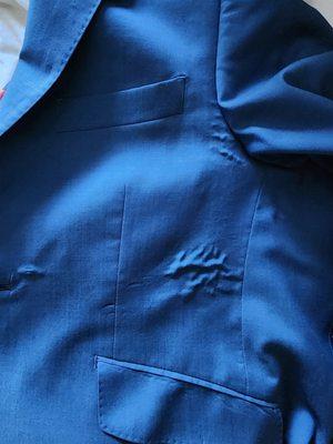 These bubbles are a telltale sign that these suits are constructed using a fused canvas method, a practice that falls far short of the tradi