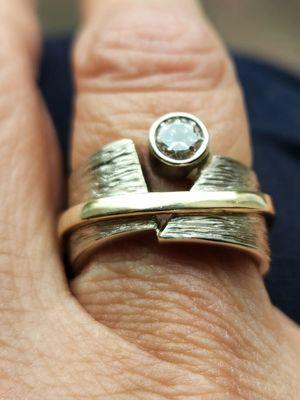 The textured engraving was added to pre-existing custom ring.  Wasn't easy but they did an AMAZING job.