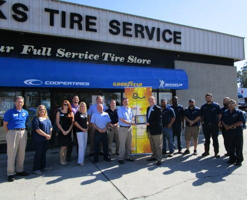 Black's Tire Team receiving "Leading Business of the Month" from MB Chamber of Commerce!