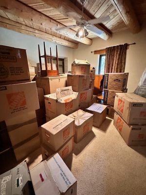 Basement room of dumped boxes