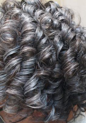 My client has decided to wear her natural hair color, and we Roller Set it in a spiral direction. Client wears a Relaxer