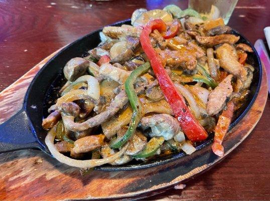 These are the Shrimp, Beef, & Chicken fajitas. There are onions, green @& red peppers tossed in a flavorful sauce.