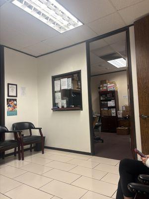 Front desk left unattended, also can see the patients on the scale because both doors are open.