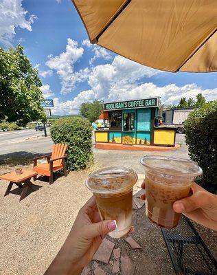 Shaded patio seating, dog beds, and water bowls