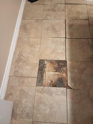 Upstairs bathroom floor. Was bumpy when we viewed it