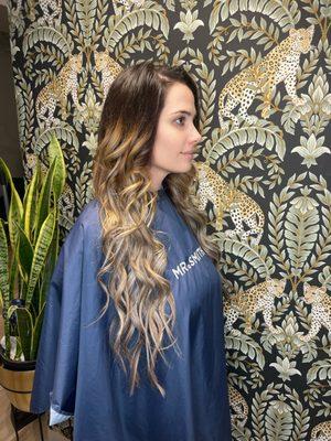Ombré with a darker root and hand tied wefts