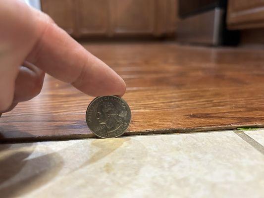 Unfinished gap of now splintered flooring.