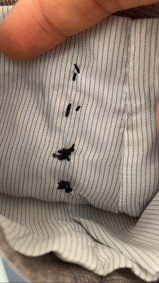 Suit jacket buttons on cuff sewn over inner lining...