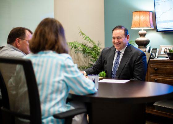 Michael Neuenschwander, CPA, CFP reviewing retirement plans with clients.