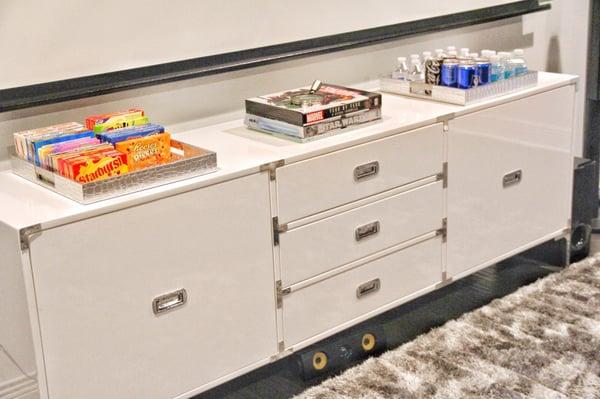 They added ventilation holes in the back to make this piece a media console.