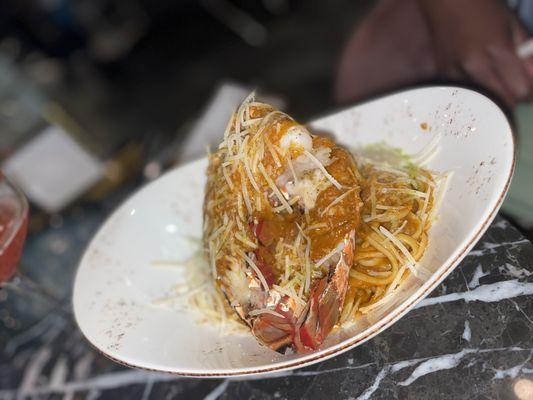 Lobster pasta tossed in tomato sauce