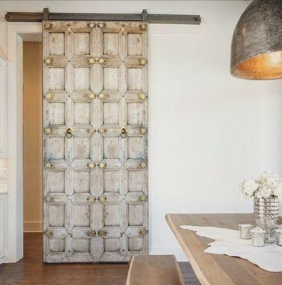 An Antique door is added to this contemporary home renovation project, A perfect rustic modern combination