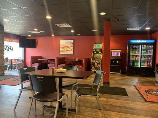 Great pizza! Dining room with social distancing between tables.