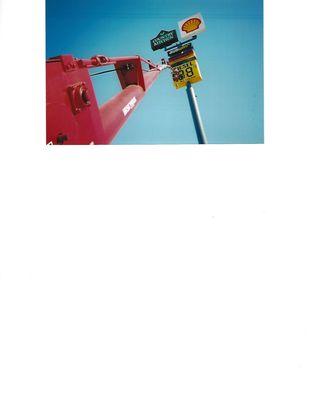 We can put vinyl graphics on entrance doors, or install signs up to 150 ft in the air or dangle 300 ft to fix a neon clock.