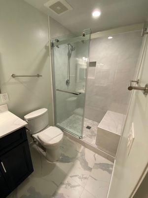 New floor tile, wall tile, toilet , and paint