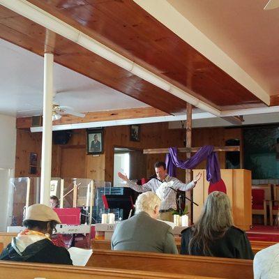 Pastor Brad conducting communion on 4-24-22