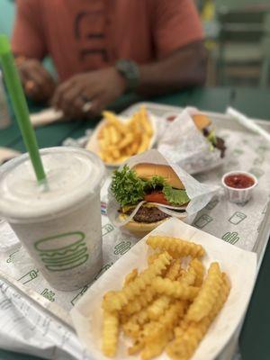 Shake ShackBurger with onion and fries and a Cookies and Cream Shake