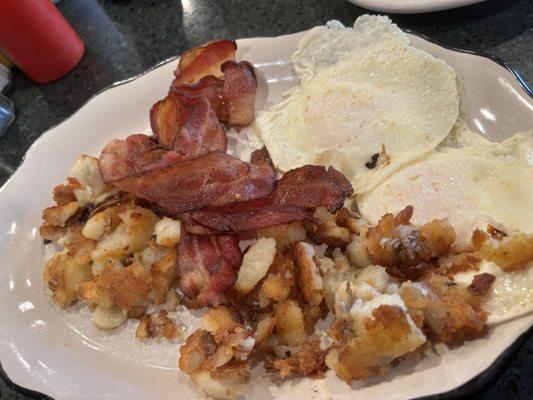 Eggs over medium, bacon and extra crispy hash browns