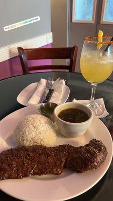 Skirt steak, rice and beans. Mezcal tequila cockatail