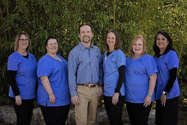 Dr. Carroll Butler and his dental team