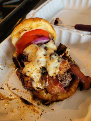 Try Chef Ben's BBQ Pork Belly burger. Topped with BBQ s bacon, red onion, lettuce and tomatoes and covered with melted provolone cheese.