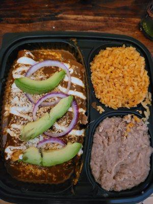Carnitas Enchiladas Mole, with refried beans & rice - nice container.