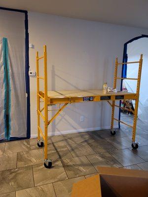 Use of scafolding is much safer for removal of drywall in ceiling. Safety is our number one priority