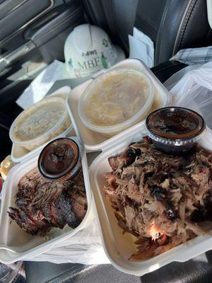 Mac and cheese pulled pork brisket and au gratin potatoes with apple bbq sauce and hot bbq sauce