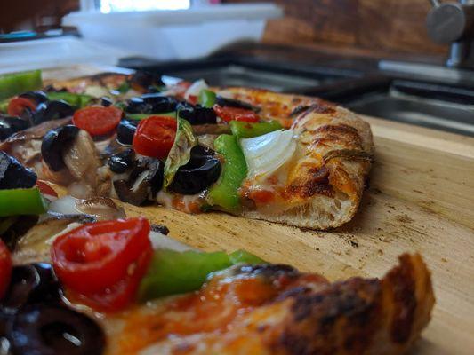 Cross-section of custom vegetarian pizza!