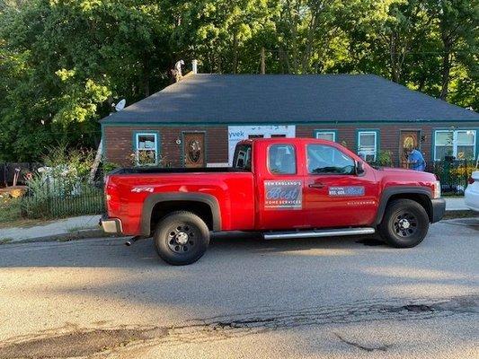 Roof Replacement in Kittery, Maine. Three layer rip, soffit venting install and flashing replacement. IKO Dynasty Shingles Granite Black.