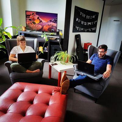 Ethos team working in lounge.