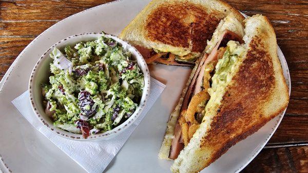 Bologna sandwich with broccoli salad.