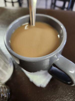 Tea or coffee , you guess what it is. Looks like coffee , taste like brewed tea.....no bueno