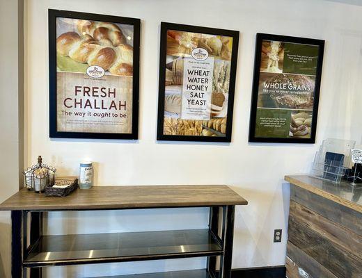 Signs about the fresh breads they are offering.